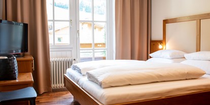Naturhotel - Auszeichnung / Zertifikat / Partner: Bio Austria - Leogang - Schlafzimmer - The RESI Apartments "mit Mehrwert"