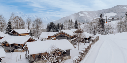 Naturhotel - Umgebungsschwerpunkt: Wald - Chalets in der Winterlandschaft - Naturresort PURADIES
