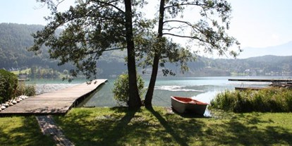 Naturhotel - auch für Familien mit Kindern - Eberstein - Badestrand mit Boot und Steg für Ihren veganen Bio-Urlaub - Loving Hut am Klopeiner See