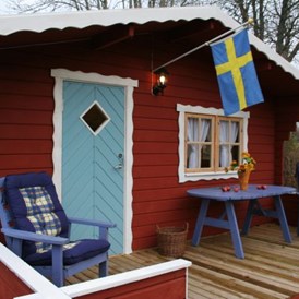 Biohotel: Neben Ferienhütten kann man hier auch Camping machen. - Lilla Sverigebyn